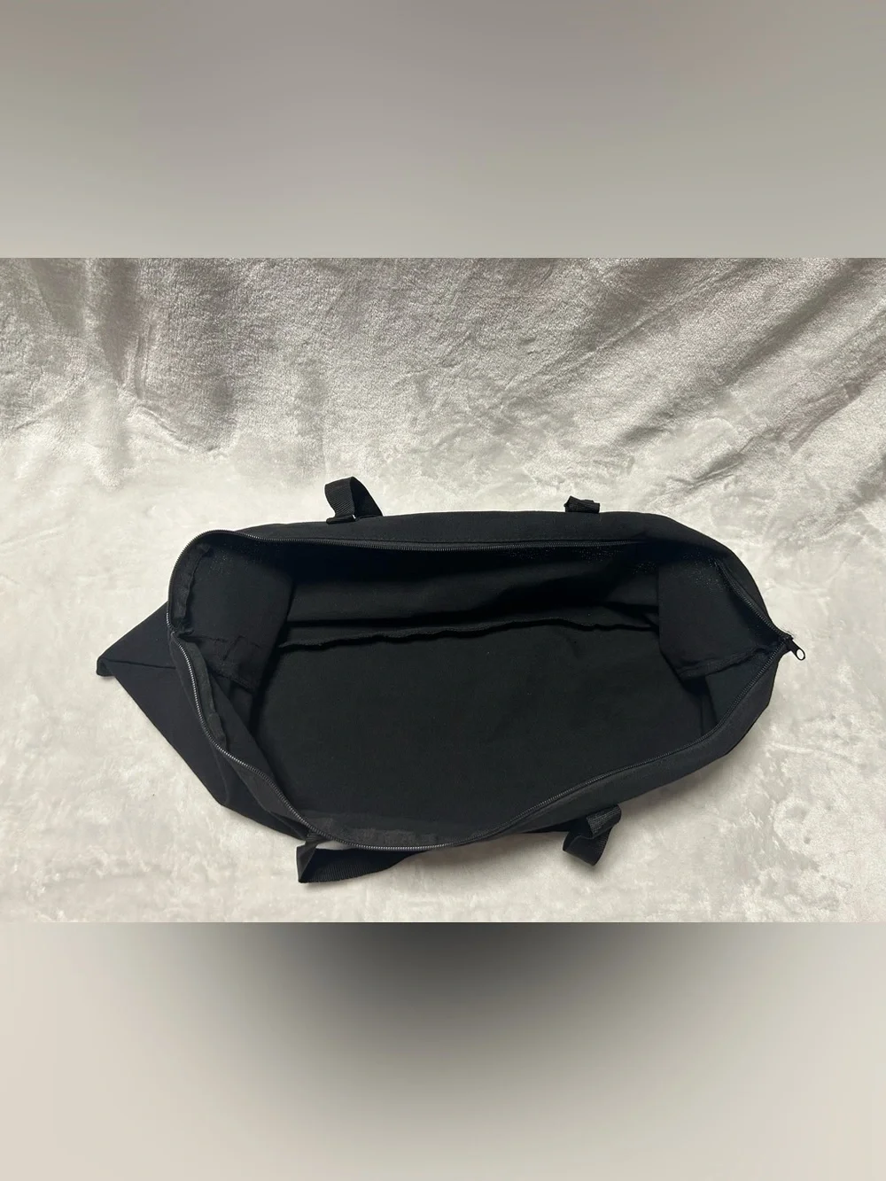 Large black zip up soft storage bag with handles